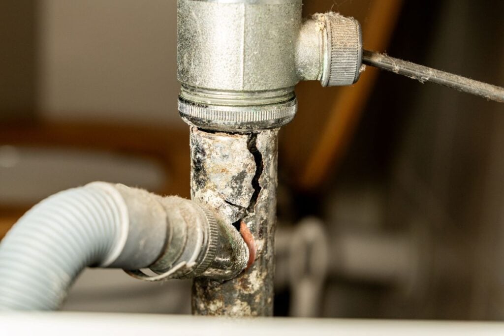Cracked pipe found by New Era after responding to an emergency plumbing call