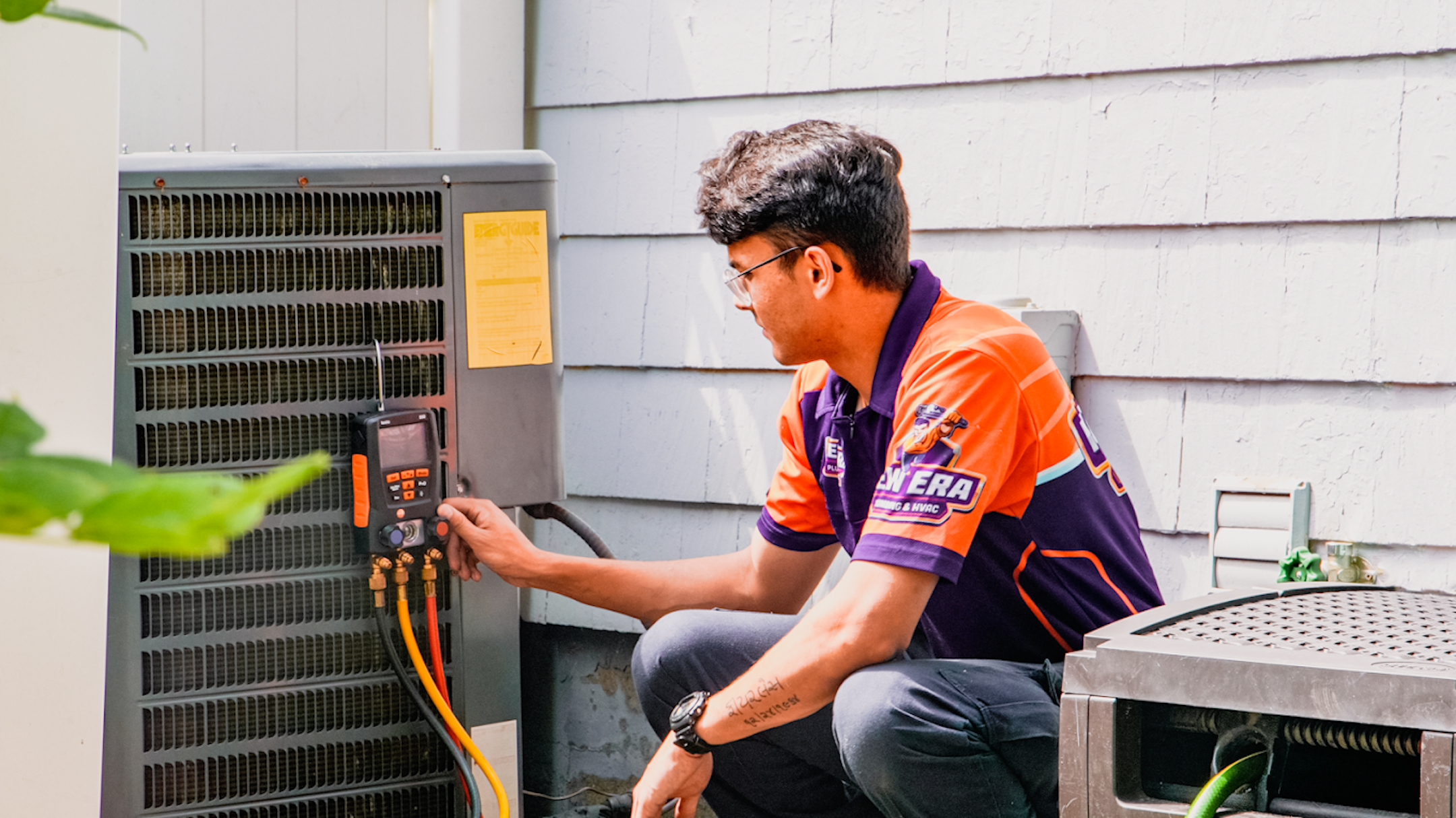 new Era worker fixing ac