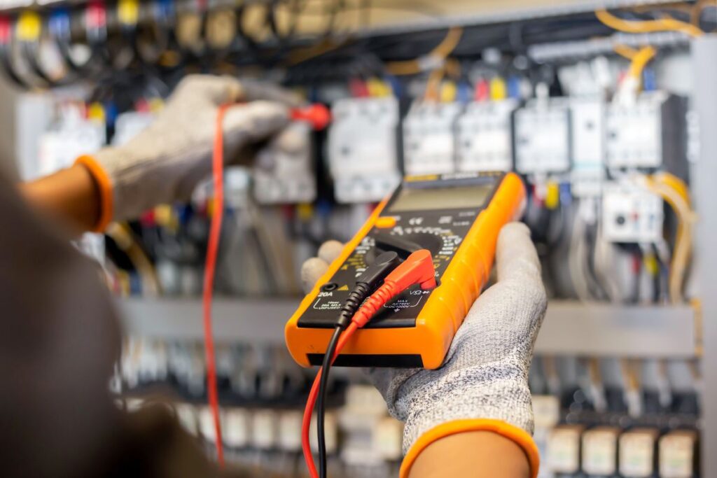 hvac tools hand holding multimeter