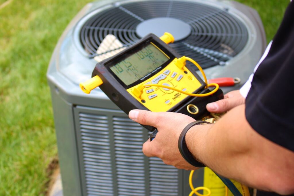 hvac tools worker checking AC
