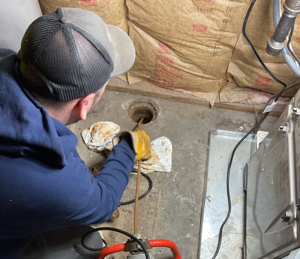 New Era Plumbing team using a hydrojet to clean the drains