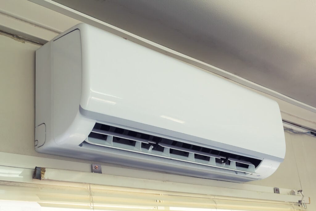 ductless air conditioner unit on the wall Air conditioner machine inside office building.