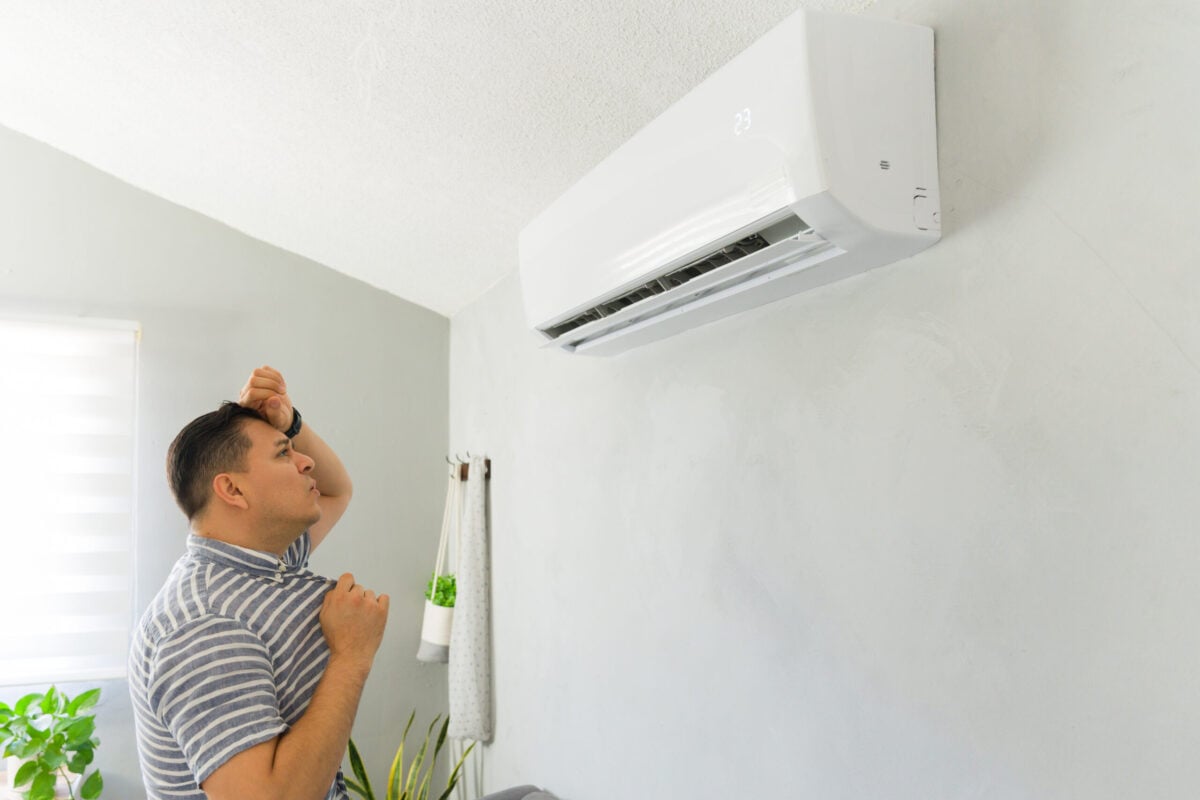 emergency ac repair man feeling hot